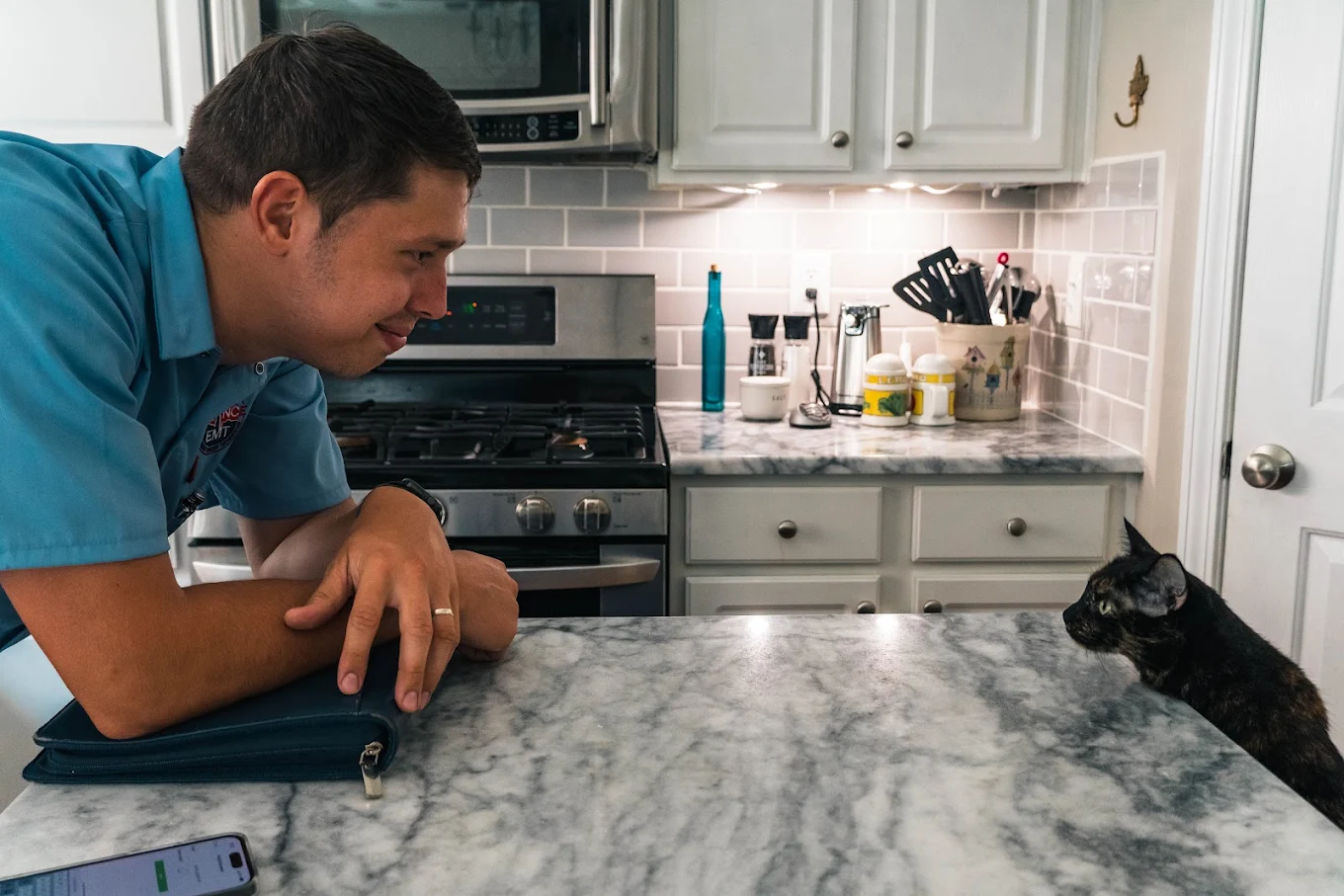 Appliance EMT team with a cat